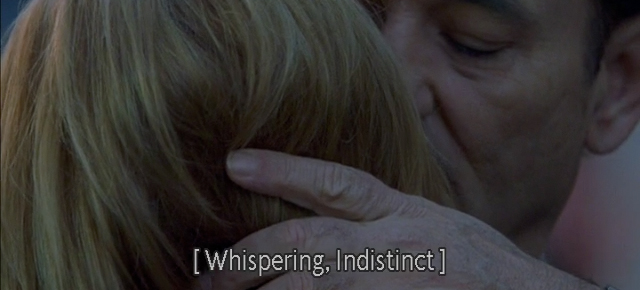 A screenshot from Lost in Translation (2003) featuring Bill Murray and Scarlett Johansson