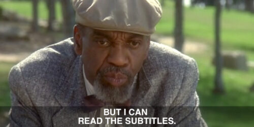Screenshot from Fatal Instinct featuring actor Bill Cobbs with subtitle: "But I can read the subtitles."