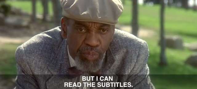 Screenshot from Fatal Instinct featuring actor Bill Cobbs with subtitle: "But I can read the subtitles."