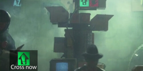 A frame from Blade Runner (1982) featuring a custom cross walk icon as an experiment caption.
